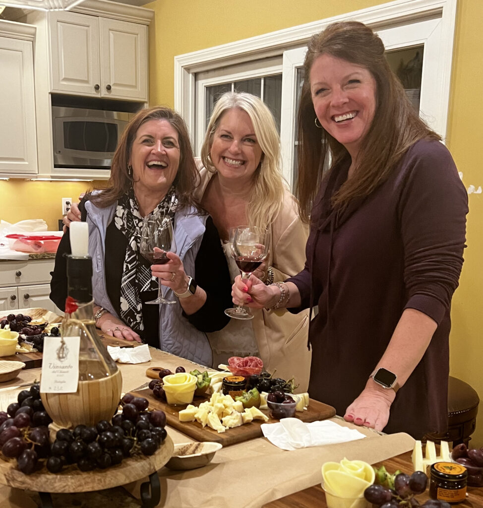 Michelle posing for a picture in the kitchen of a client's home while having fun during a private class