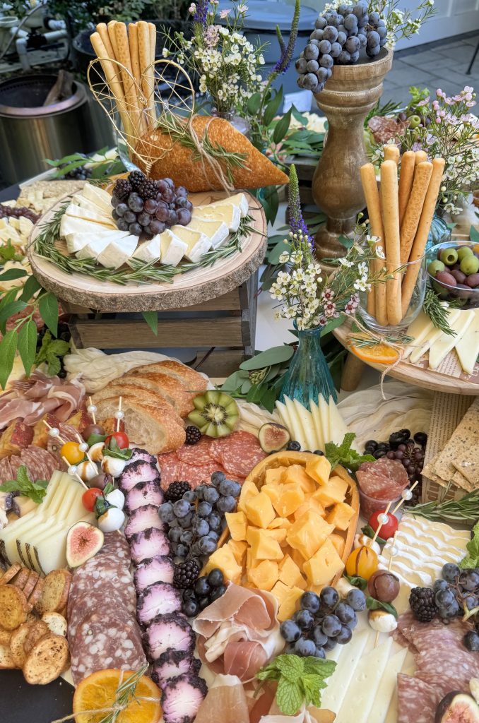 Beautiful charcuterie grazing table setup for a client event